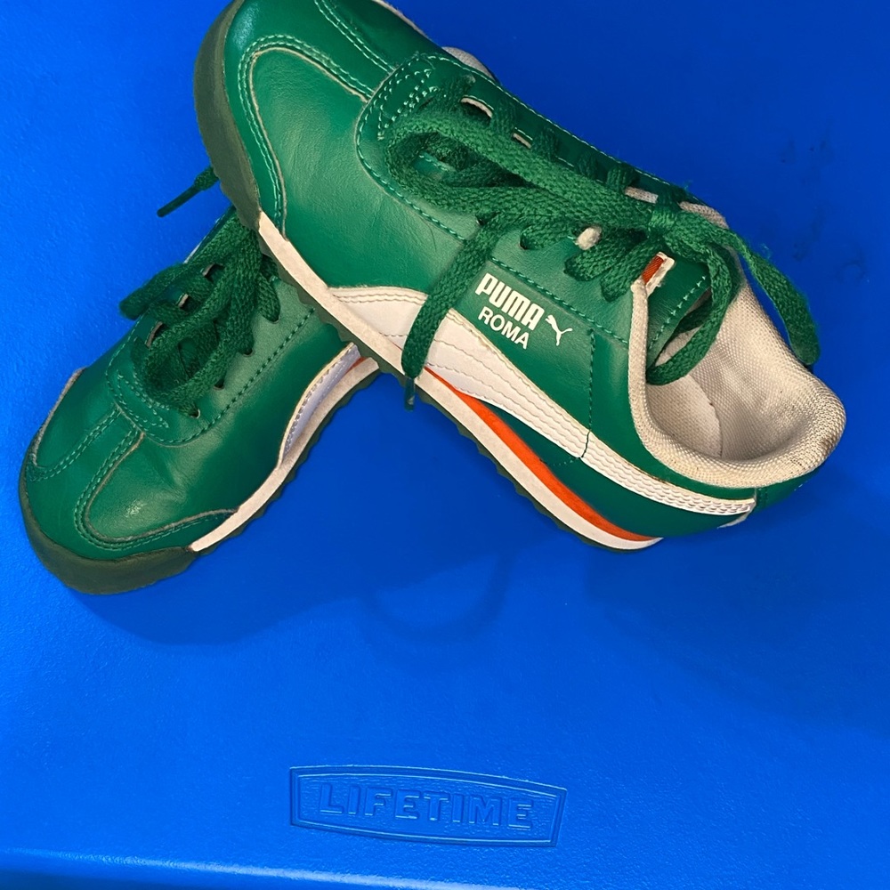 Green “child” puma tennis shoes